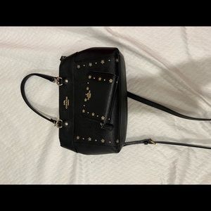 Blacked Coach bag and wallet to match